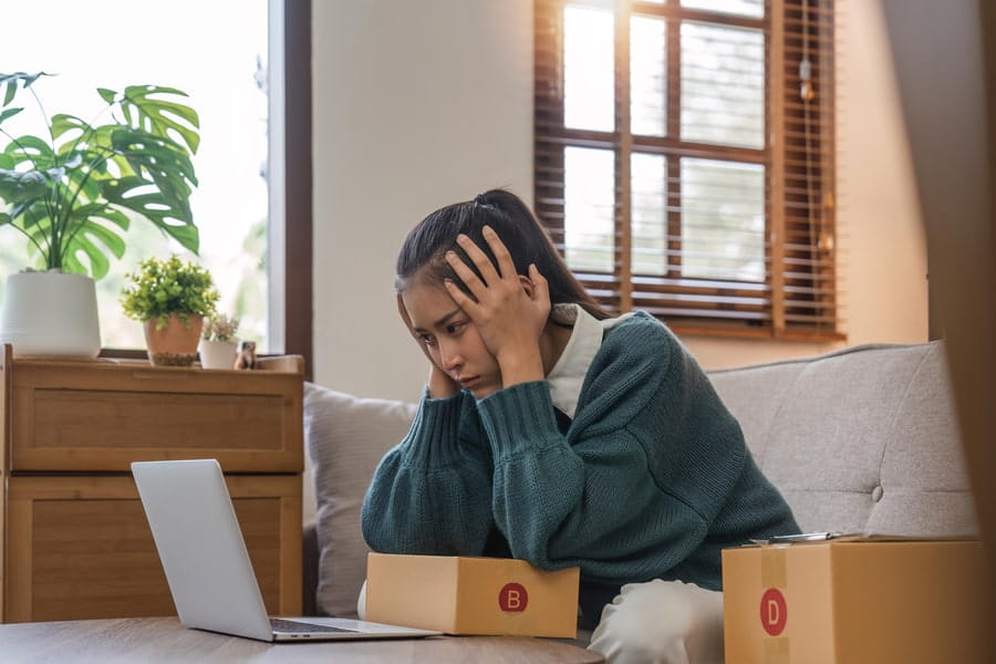 photo of a tired woman with a laptop
