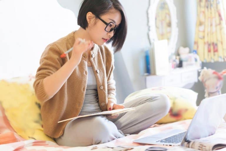 Asian-woman-playing-with-her-laptop-at-home-768x512.jpg