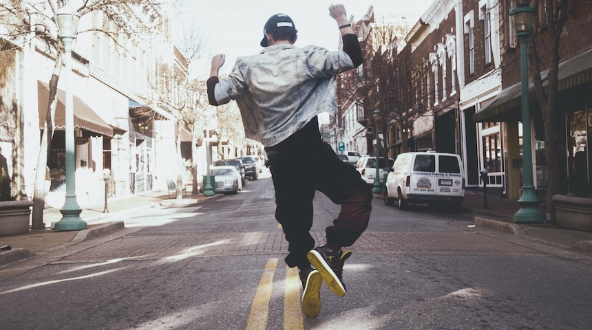 a picture showing a man dancing on the street -- how TikTok appeared