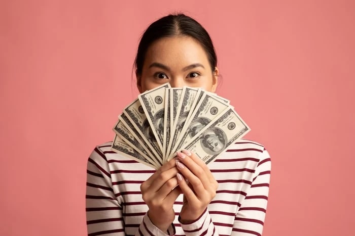 Photo of a woman with money