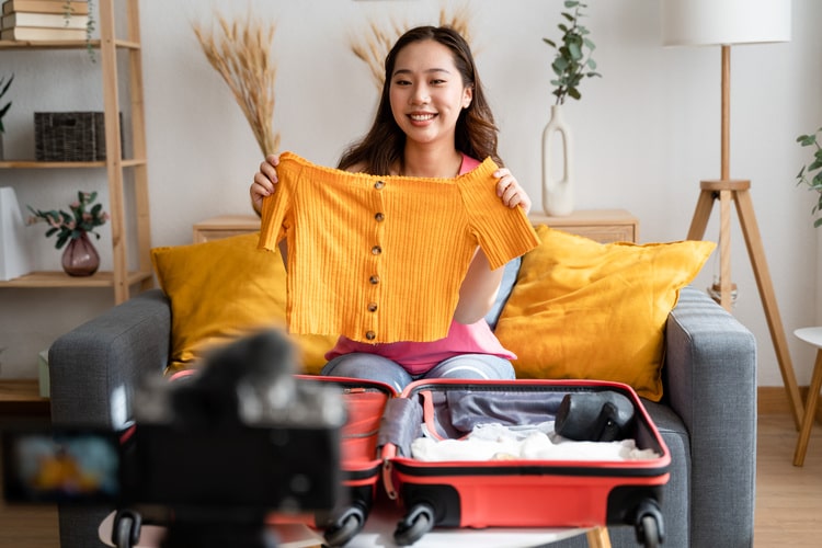 Picture of a woman making a video with fashion